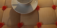 Foto: Projekt "Design & Illusion". Ein Tasse mit Untertasse steht auf einem Tisch.